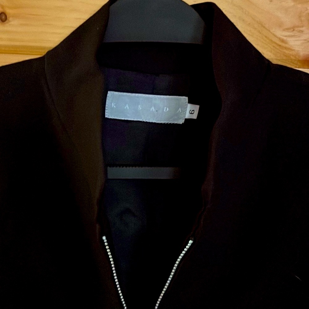 Black wool blazer. Zipper closure. Size 6. Beautiful condition.